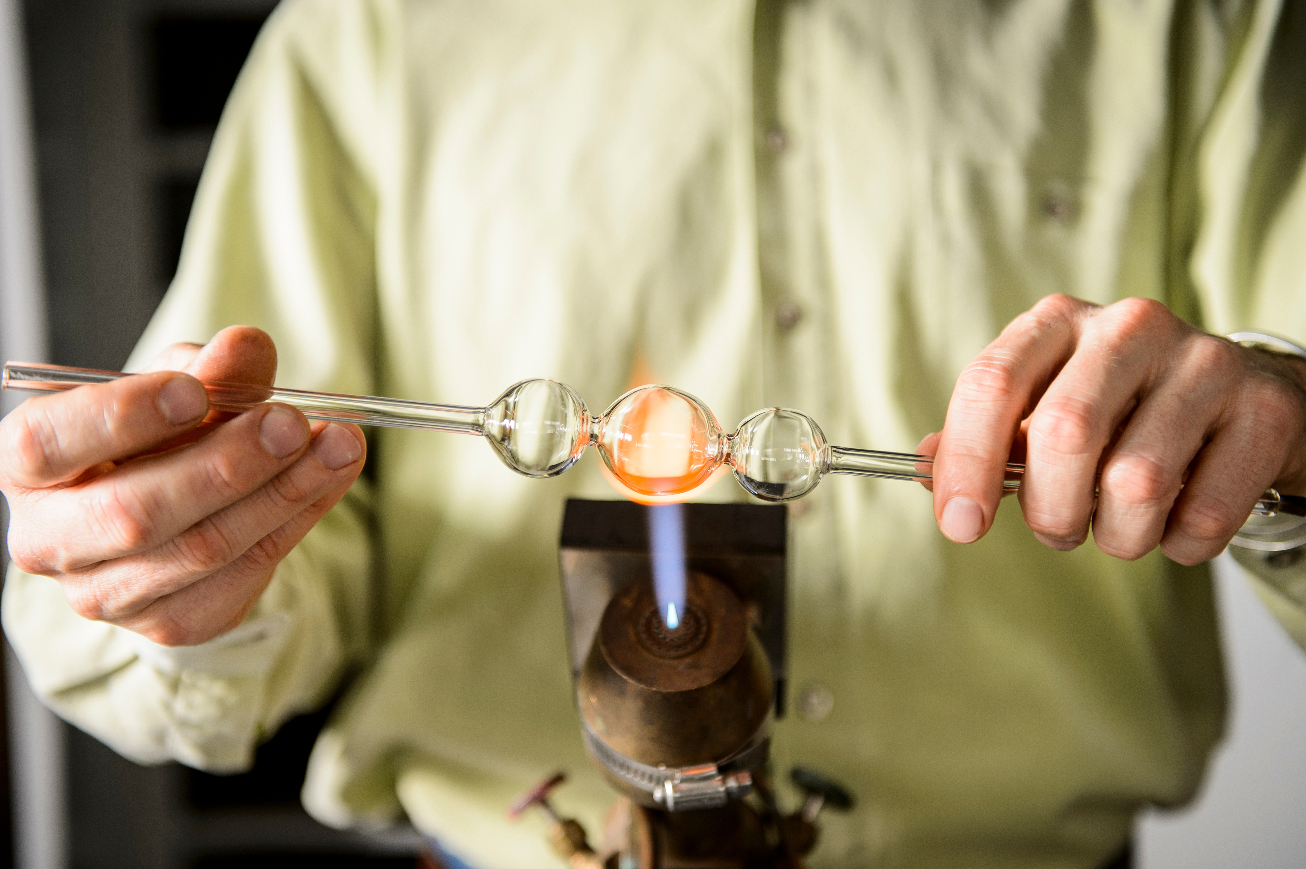 Glassblower T. Drier creates a glass instrument